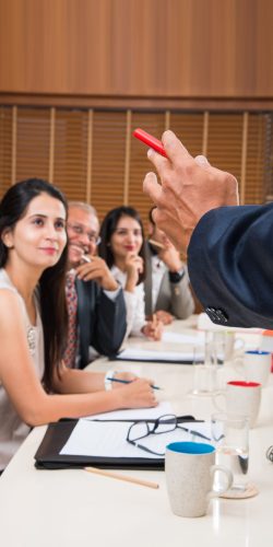 Asian Indian Business People or Corporate culture and Working in the office Concept with Laptop, papers, meetings, presentations and discussions